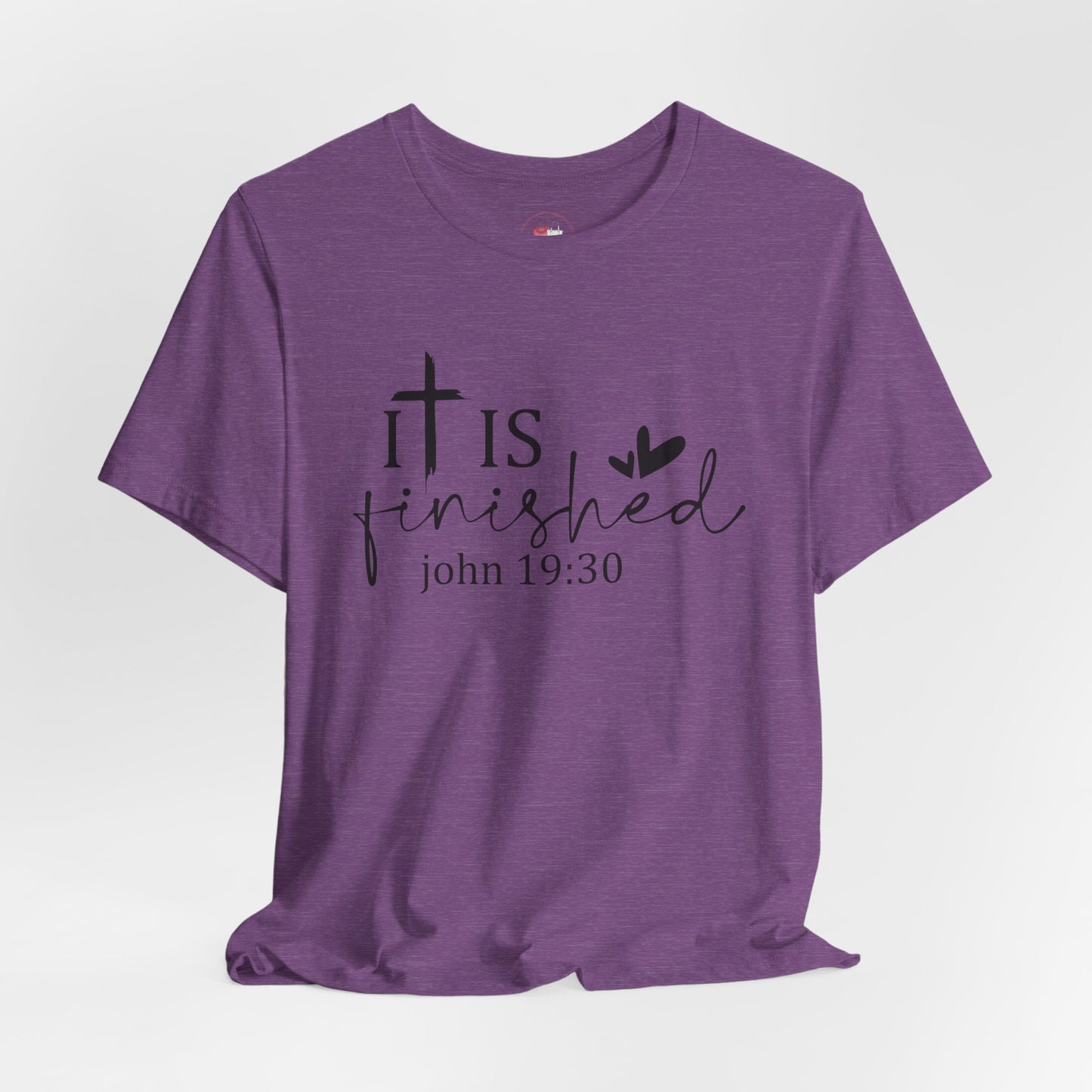 Purple t-shirt with 'It is finished' text and cross design on a white background, Bible scripture