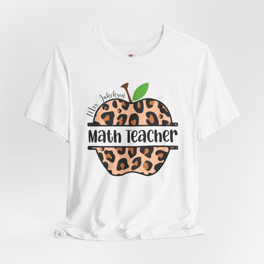 White t-shirt with leopard print apple design and text on a white background
