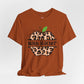 Brown t-shirt with leopard print apple graphic and 'Math Teacher' text on a white background