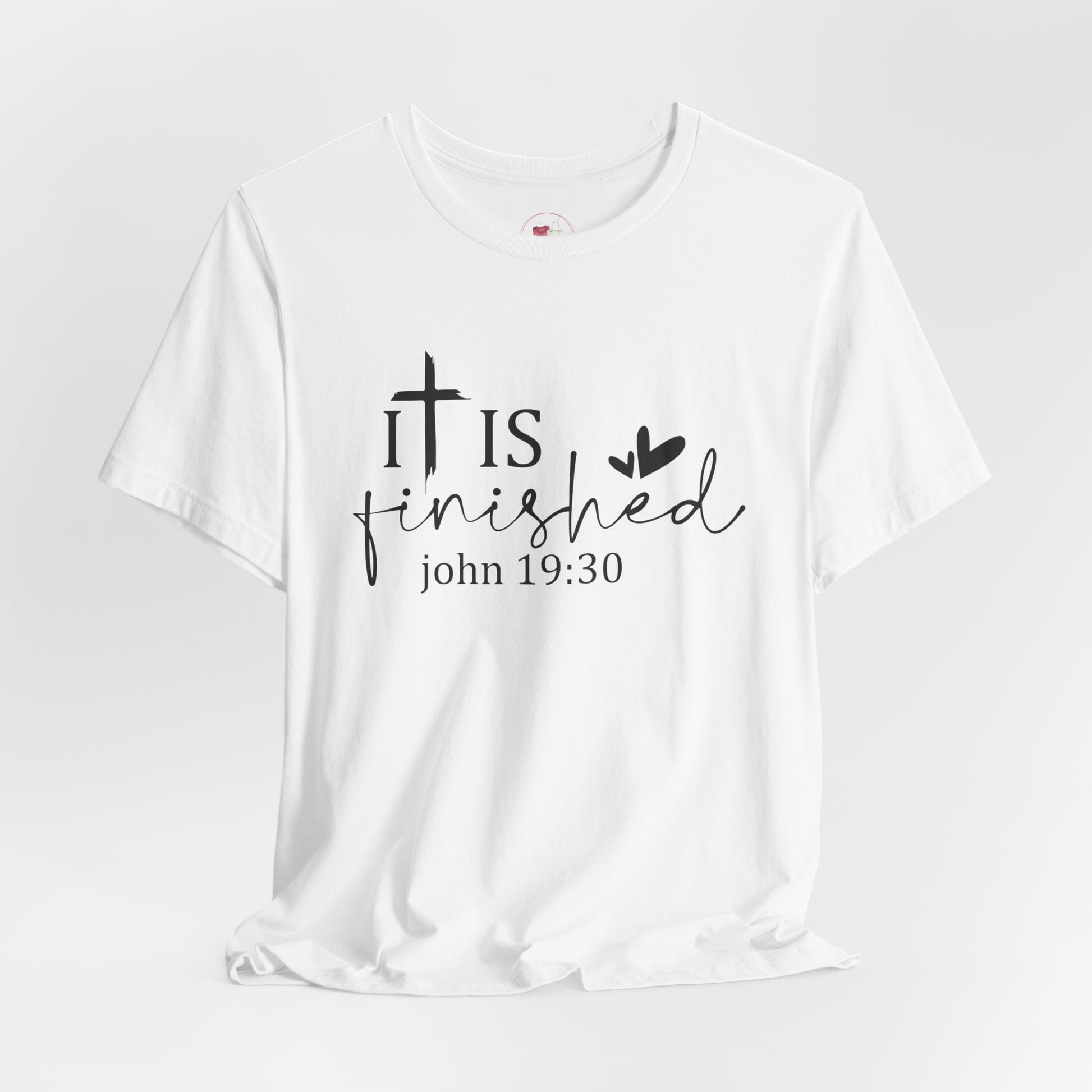 White t-shirt with 'It is finished' text and cross design on a white background