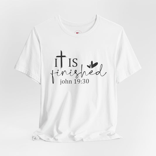 White t-shirt with 'It is finished' text and cross design on a white background