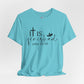 Light blue  t-shirt with 'It is finished' text and cross design on a white background, Bible scripture 