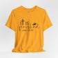 Gold t-shirt with 'It is finished' text and cross design on a white background, Bible scripture 